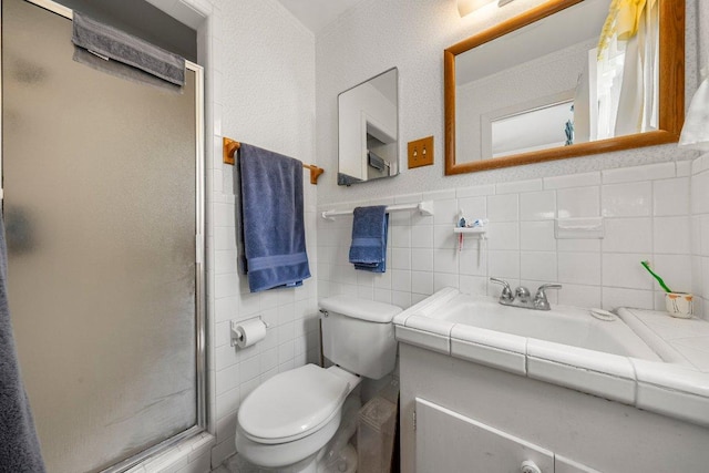 3108 W Terrace Dr, Austin, TX 78757 - full bath featuring a stall shower, toilet, tile walls, and vanity