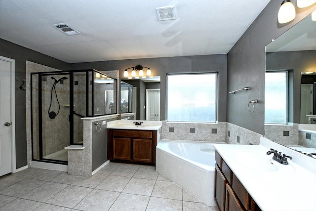 15628 Interlachen Dr, Austin, TX 78717 - bathroom with healthy amount of natural light, a stall shower, a bath, and two vanities