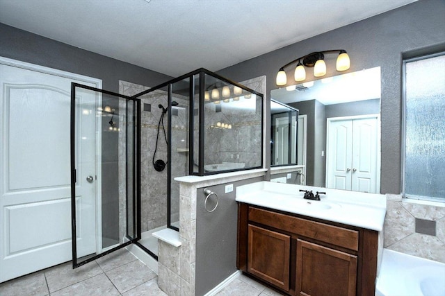 15628 Interlachen Dr, Austin, TX 78717 - full bath with a stall shower, tile patterned flooring, vanity, and a garden tub