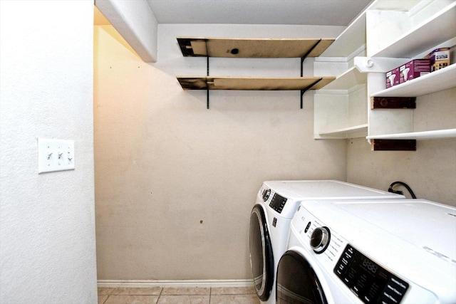 15628 Interlachen Dr, Austin, TX 78717 - laundry room with washing machine and clothes dryer and light tile patterned floors