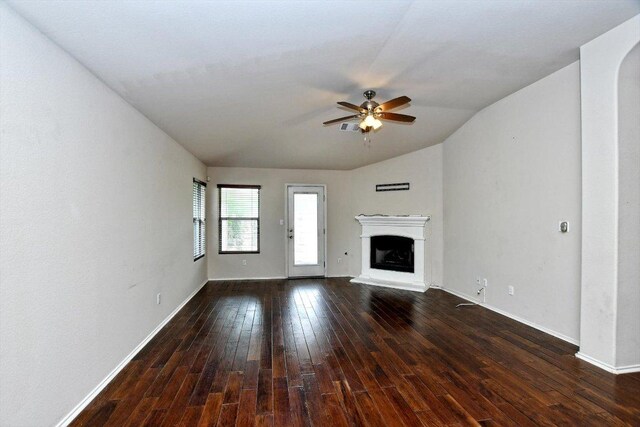15628 Interlachen Dr, Austin, TX 78717 - unfurnished living room featuring a ceiling fan, wood-type flooring, a fireplace with raised hearth, and lofted ceiling