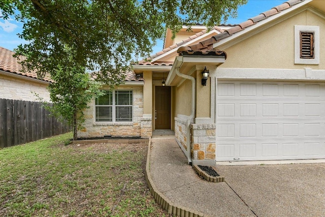 15628 Interlachen Dr, Austin, TX 78717 - view of front of house with a tiled roof, stone siding, a garage, and stucco siding