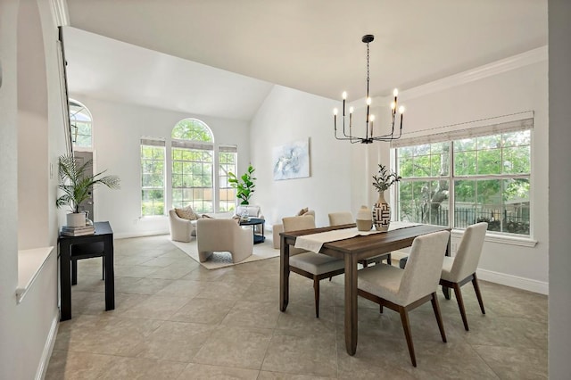 dining room featuring a chandelier, light tile patterned floors, baseboards, and lofted ceiling