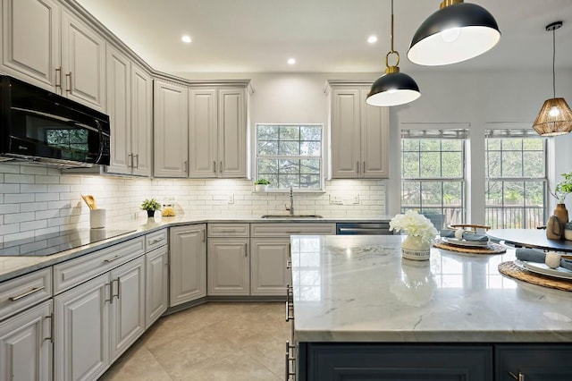 kitchen featuring black appliances, a sink, gray cabinetry, tasteful backsplash, and recessed lighting