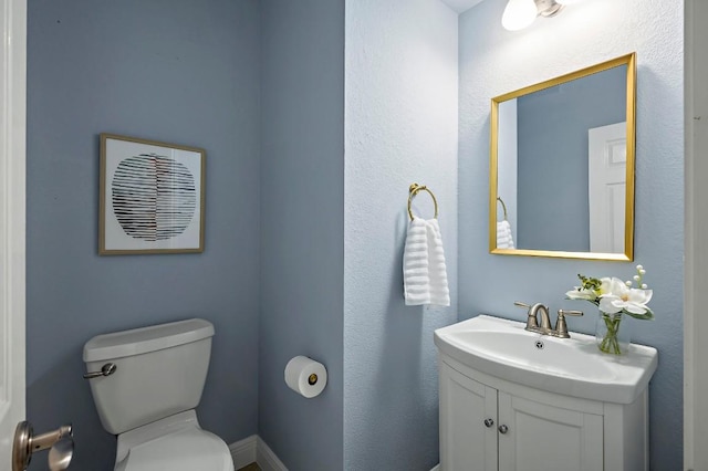half bath with toilet and vanity