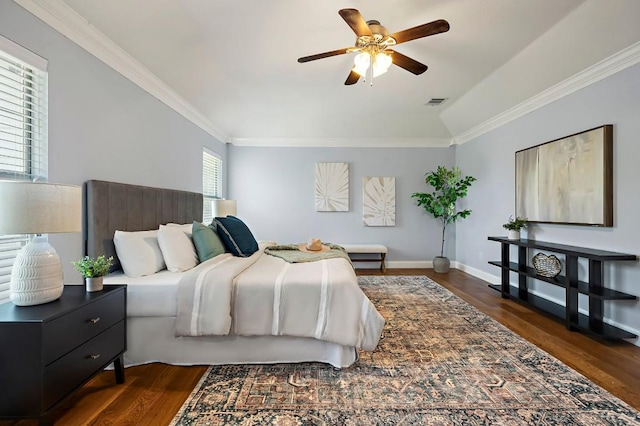 bedroom with dark wood-style floors, crown molding, baseboards, and ceiling fan