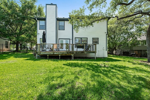 back of property featuring a deck and a chimney