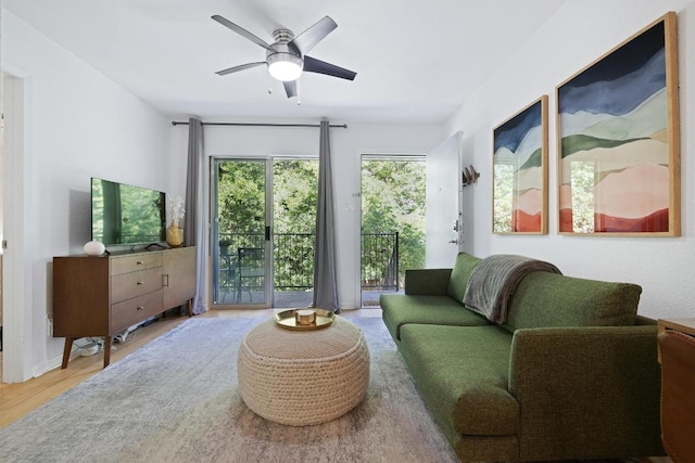 3204 Menchaca Rd Unit 716, Austin, TX 78704 - living room featuring a ceiling fan and wood finished floors