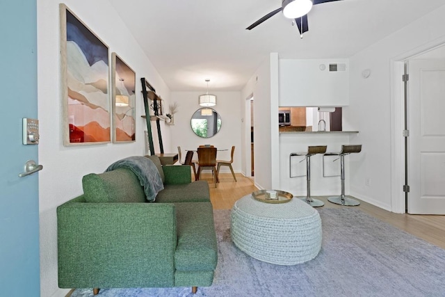 3204 Menchaca Rd Unit 716, Austin, TX 78704 - living area with wood finished floors and ceiling fan