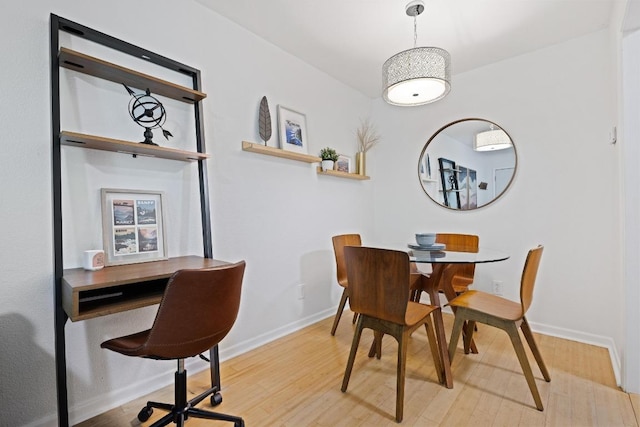 3204 Menchaca Rd Unit 716, Austin, TX 78704 - dining room featuring wood finished floors, baseboards, and a desk