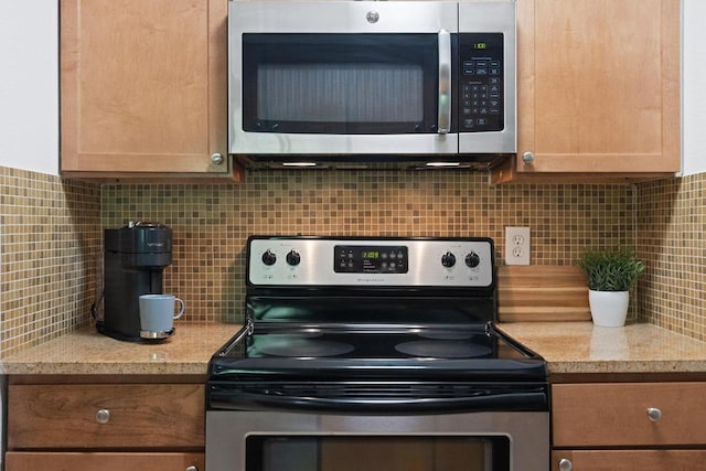 3204 Menchaca Rd Unit 716, Austin, TX 78704 - kitchen with appliances with stainless steel finishes and tasteful backsplash