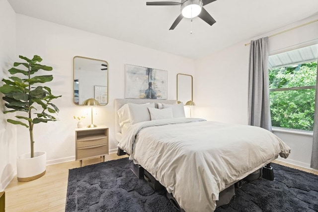 3204 Menchaca Rd Unit 716, Austin, TX 78704 - bedroom featuring wood finished floors, baseboards, and ceiling fan
