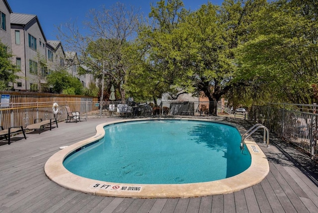 3204 Menchaca Rd Unit 716, Austin, TX 78704 - community pool with fence and a wooden deck