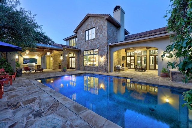 505 Indigo Ln, Georgetown, TX 78628 - outdoor pool with french doors and a patio