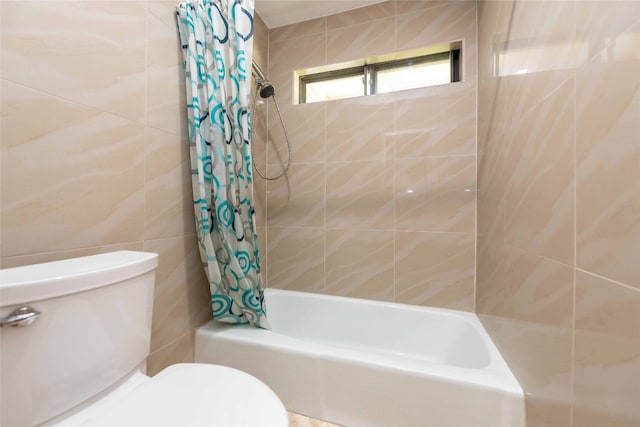 bathroom with toilet and shower / bath combo with shower curtain