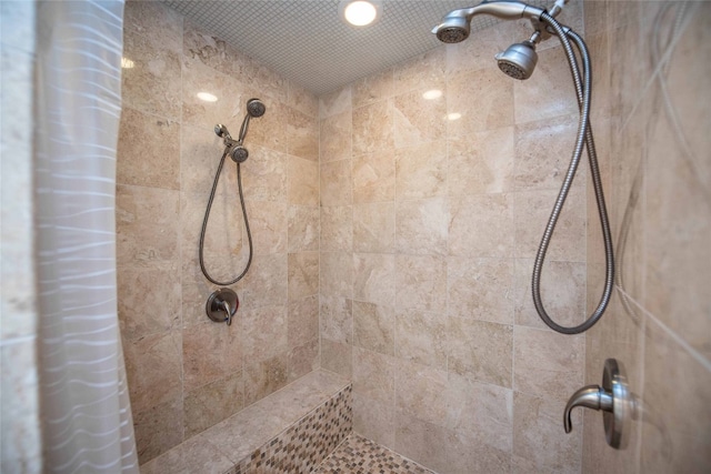 bathroom with tiled shower