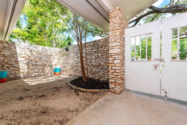 view of patio featuring fence
