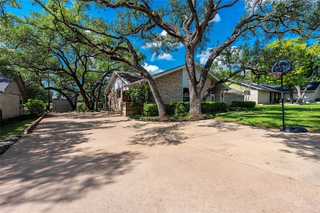 11532 Spicewood Pkwy, Austin, TX 78750 - view of home's exterior with brick siding