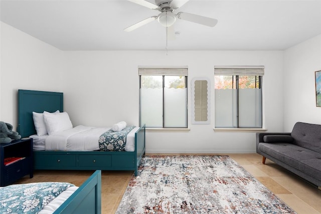 11532 Spicewood Pkwy, Austin, TX 78750 - bedroom featuring a ceiling fan and baseboards
