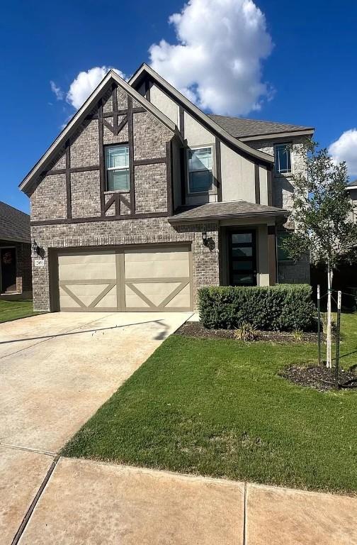 2050 Egret Ave, New Braunfels, TX 78132 - view of front of property featuring an attached garage, driveway, and a front yard