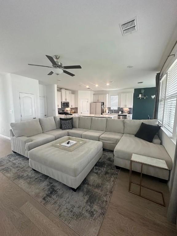 2050 Egret Ave, New Braunfels, TX 78132 - living area with dark wood-style floors, a ceiling fan, and recessed lighting