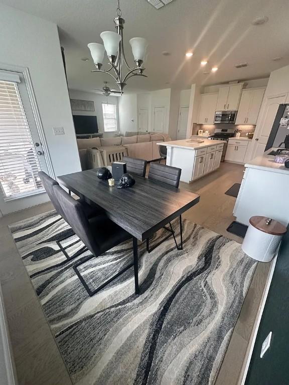 2050 Egret Ave, New Braunfels, TX 78132 - dining space featuring a chandelier and recessed lighting