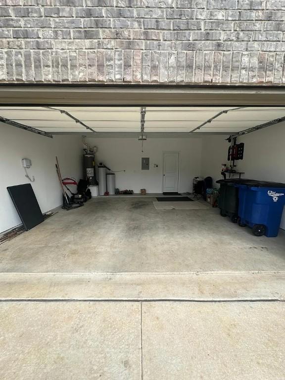 2050 Egret Ave, New Braunfels, TX 78132 - garage with electric panel and electric water heater