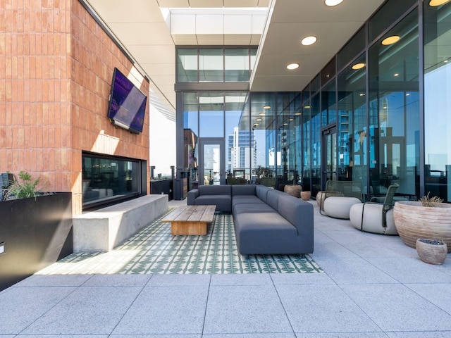 community lobby with a high ceiling and recessed lighting