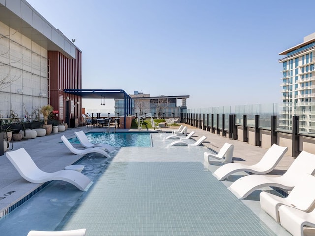 community pool featuring a patio area
