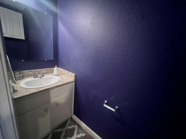1912 Lightsey Rd Unit 1, Austin, TX 78704 - bathroom with a textured wall, vanity, and baseboards