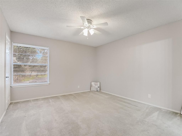 1912 Lightsey Rd Unit 1, Austin, TX 78704 - carpeted spare room with a ceiling fan, baseboards, and a textured ceiling