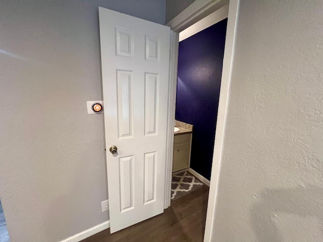 1912 Lightsey Rd Unit 1, Austin, TX 78704 - corridor featuring baseboards, dark wood-style floors, and a textured wall