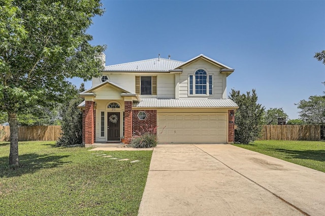 traditional home featuring a garage, driveway, brick siding, and metal roof