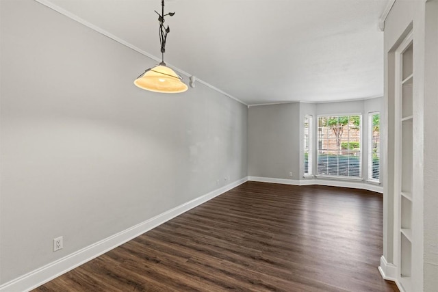 7920 Rockwood Ln Unit 104, Austin, TX 78757 - empty room with dark wood-type flooring, baseboards, and crown molding