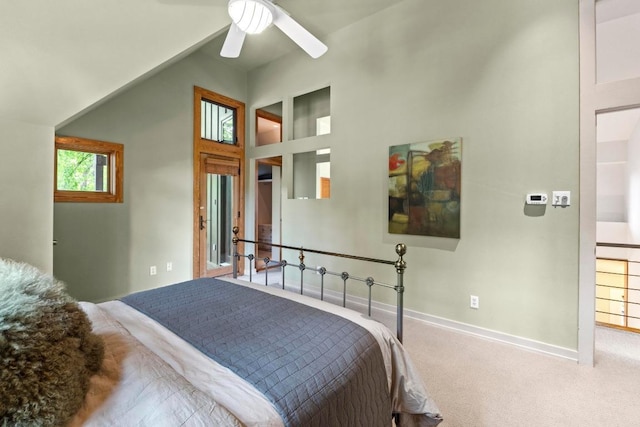 carpeted bedroom with baseboards, high vaulted ceiling, and ceiling fan