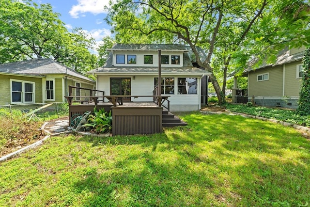 back of house featuring a deck
