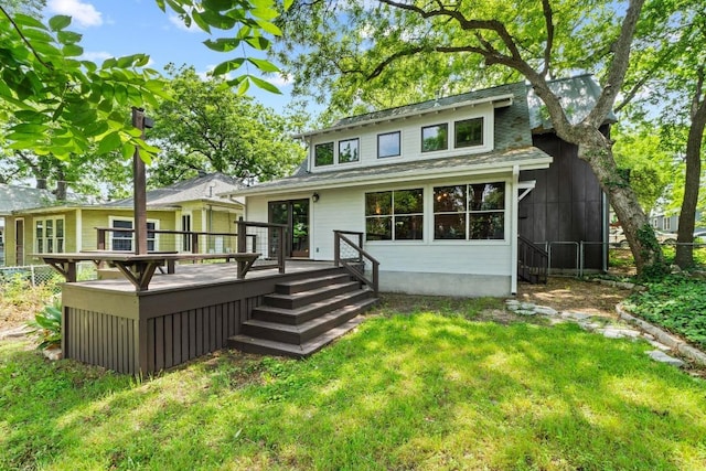 back of property with a deck