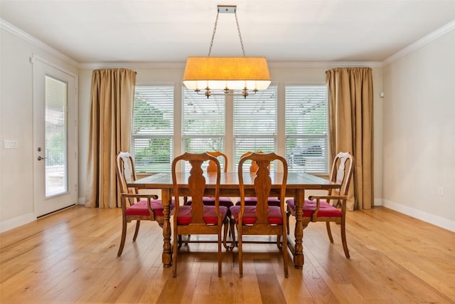 419 Davis Mountain Cir, Georgetown, TX 78633 - dining space with ornamental molding, light wood-style floors, baseboards, and a chandelier