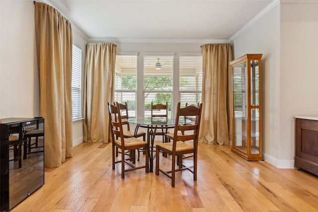 419 Davis Mountain Cir, Georgetown, TX 78633 - dining space featuring crown molding, light wood-style flooring, and baseboards