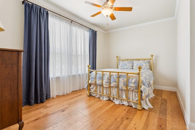 419 Davis Mountain Cir, Georgetown, TX 78633 - bedroom featuring hardwood / wood-style flooring, ornamental molding, baseboards, and ceiling fan