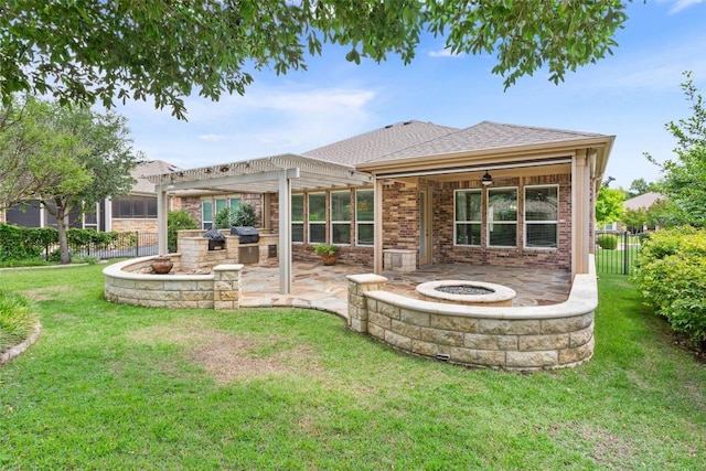 419 Davis Mountain Cir, Georgetown, TX 78633 - rear view of house with a fire pit, a patio area, exterior kitchen, a pergola, and brick siding