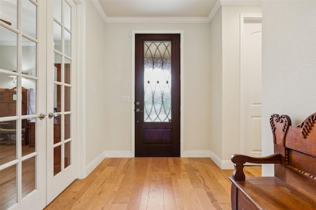 419 Davis Mountain Cir, Georgetown, TX 78633 - entryway with french doors, baseboards, light wood-style floors, and crown molding
