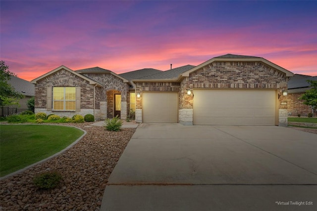 419 Davis Mountain Cir, Georgetown, TX 78633 - view of front facade with a garage, driveway, brick siding, and a shingled roof