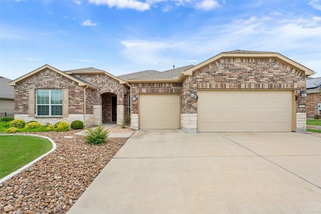 419 Davis Mountain Cir, Georgetown, TX 78633 - french provincial home featuring an attached garage, driveway, brick siding, and roof with shingles