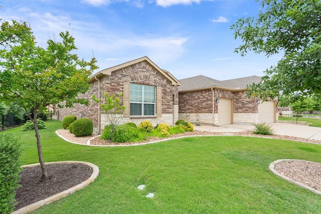 419 Davis Mountain Cir, Georgetown, TX 78633 - view of front of property featuring concrete driveway, a front lawn, a garage, brick siding, and stone siding