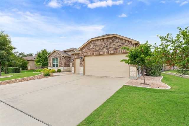 419 Davis Mountain Cir, Georgetown, TX 78633 - view of front of house with a garage, driveway, a front yard, stone siding, and brick siding
