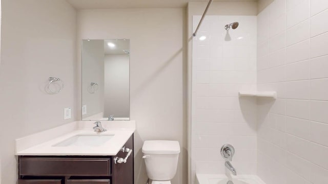 full bathroom with bathtub / shower combination, vanity, and toilet