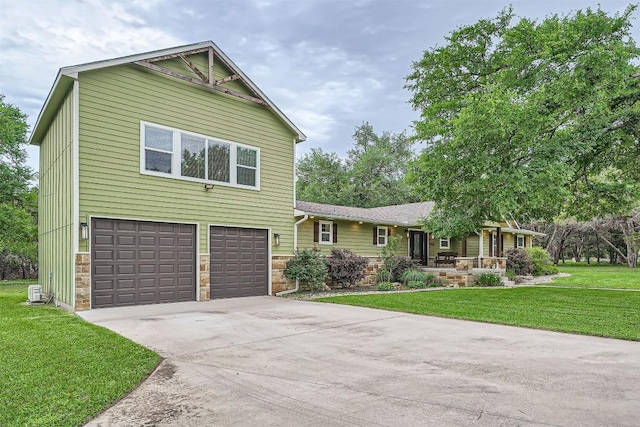 100 Comanche Trl, Georgetown, TX 78633 - view of front of property with stone siding, a front lawn, driveway, and an attached garage