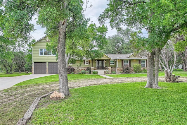 100 Comanche Trl, Georgetown, TX 78633 - ranch-style house featuring concrete driveway, stone siding, a garage, covered porch, and a front yard
