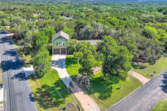 100 Comanche Trl, Georgetown, TX 78633 - aerial view of property and surrounding area featuring a heavily wooded area
